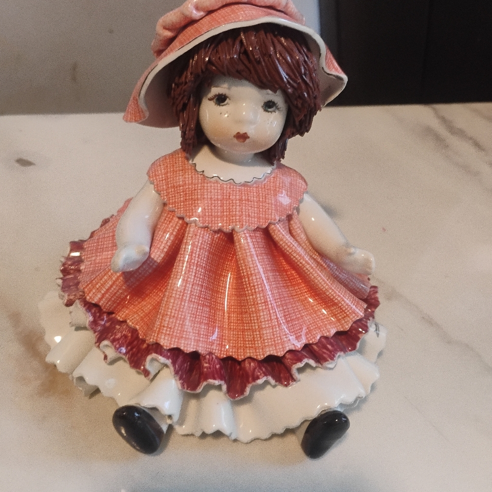 Charming Porcelain Doll Sculpture in Pink and White